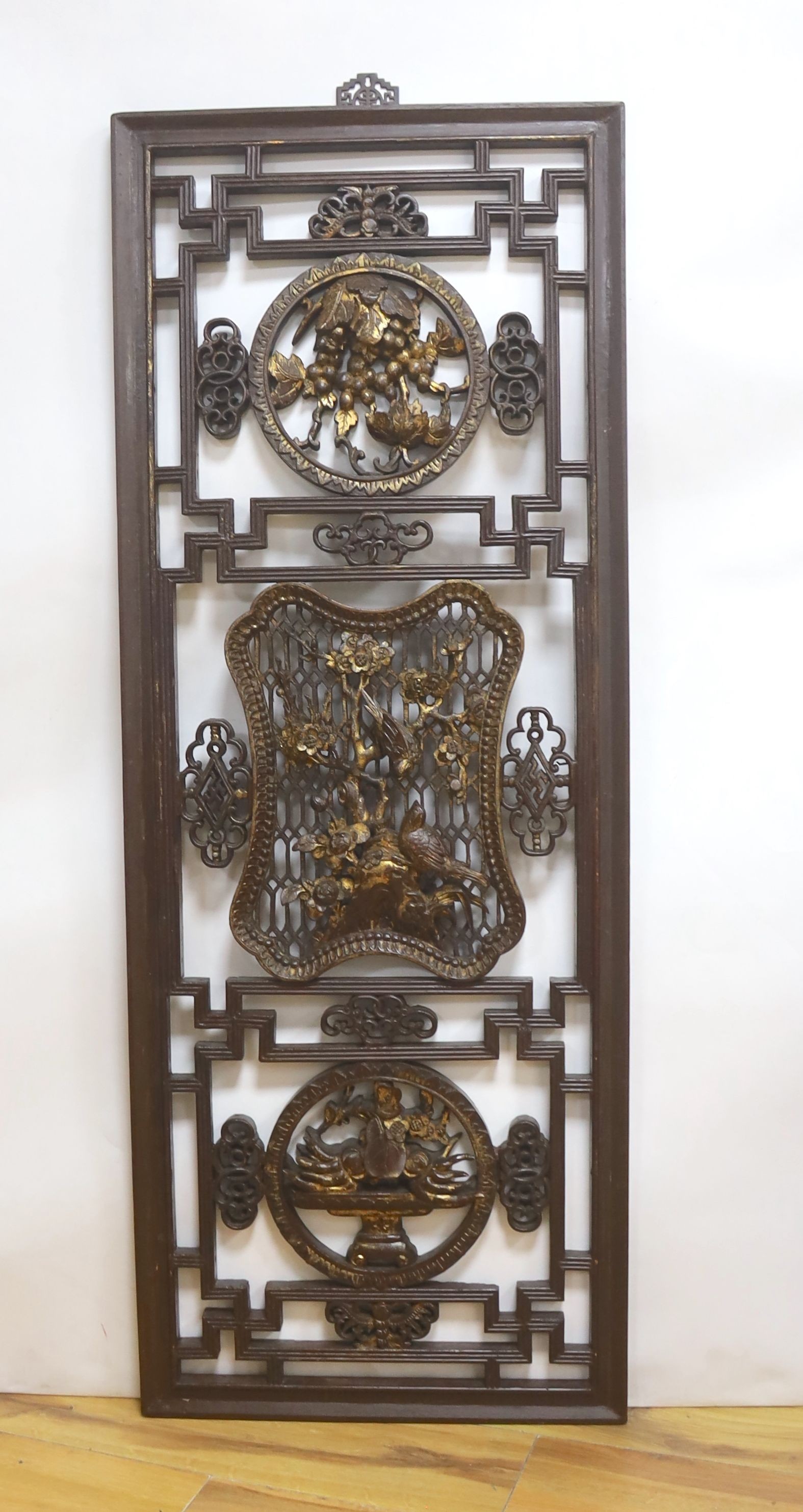 A 19th century Chinese gilded and lacquered wood panel 126 x 48cm